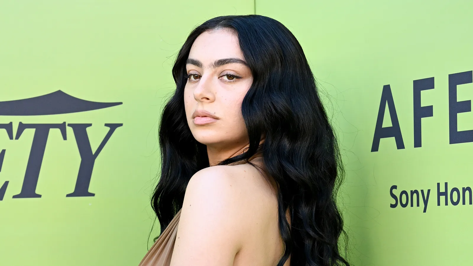charli xcx brown dress Charli xcx made a daring fashion statement in a sheer dress at Variety's Hitmakers Brunch today in Los Angeles. She was honored as the Hitmaker of the Year. We've got more photos